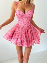 Pink floral dress worn by a person on a white background